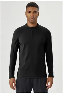 Front view of men's black half-zip long-sleeved sports shirt for fitness