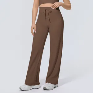 Detailed view of high-waisted coffee brown drawstring yoga pants with loose wide-leg fit