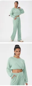 Detail shot of sage green waffle knit loungewear set featuring cropped top and wide-leg pants