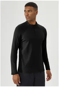 Men's black half-zip athletic long sleeve shirt for running and outdoor winter fitness