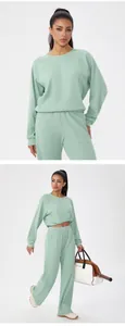 Full-body and medium shots of a mint green waffle-knit tracksuit with loungewear details.