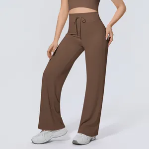 Detailed view of high-waisted brown yoga pants with drawstring and wide leg design