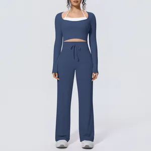 Professional model shot of a blue brushed long-sleeve yoga set with wide-leg trousers