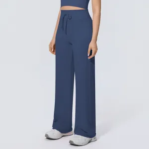 Navy blue wide-leg sports trousers with drawstring waist shown on model detail view