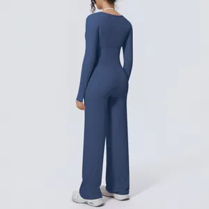 Back view of blue long-sleeve yoga set with high-waisted wide-leg fitness pants.