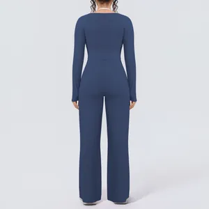 Back view of a long-sleeved yoga set with high-waisted wide-leg trousers in navy blue
