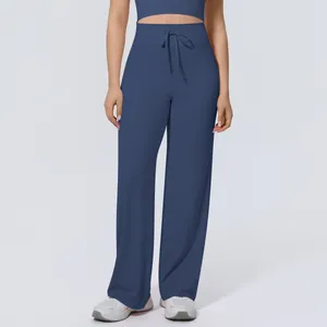 Front view detail of high-waist drawstring wide-leg yoga pants in deep blue color