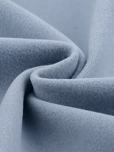Close-up of men's thermal fleece fabric showing 80% polyester and 20% spandex texture