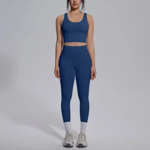 Full view of a navy blue two-piece yoga set featuring a V-neck sports bra and leggings