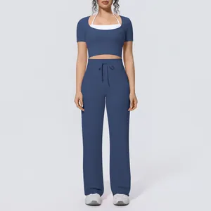Two-piece yoga set with blue short sleeve halter top and wide-leg drawstring pants