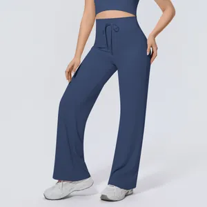 Detail view of high-waisted navy blue wide-leg yoga pants with adjustable drawstring