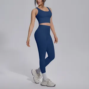Detail shot of a navy blue two-piece yoga set with high-waist leggings and sports bra.