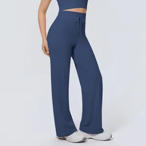 Detail view of high waisted navy blue wide leg yoga pants with functional drawstring