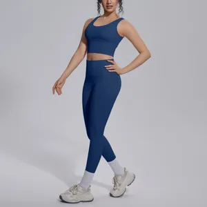 Fit view of model in navy blue V-neck sports bra and matching high-waisted gym leggings