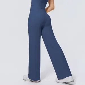 Detailed back view of high-waisted navy blue wide leg yoga pants with loose fit drape