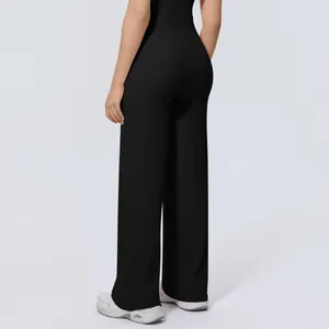 Back view of black high-waisted wide-leg yoga pants with a slimming draped fit.
