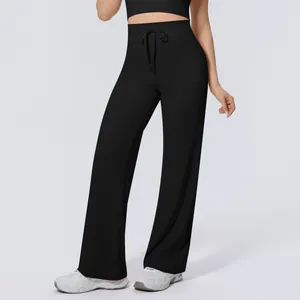 Detail shot of black high-waisted drawstring wide-leg yoga pants for fitness workout
