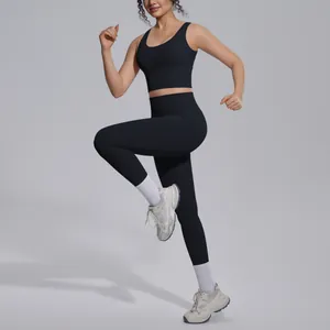 Professional macro view of a women's black high-waist yoga set in a dynamic running pose