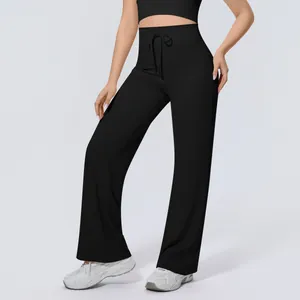Detailed view of high-waisted black wide-leg yoga pants with drawstring waist.