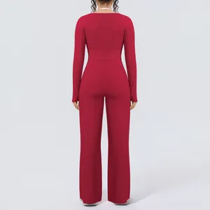 Back view of red long-sleeve yoga set with wide-leg pants showing slim fit silhouette
