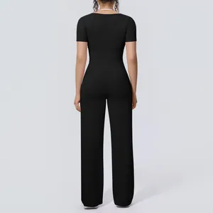 Detailed back view of a breathable women's black yoga set with wide-leg pants.