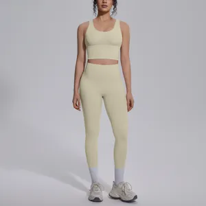 Full view of woman in a light yellow V-neck sports bra and high-waisted yoga leggings set.