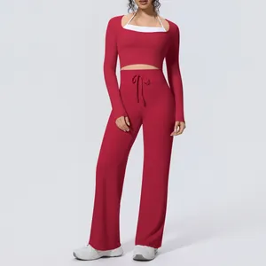 Wine red two-piece yoga set featuring a long-sleeve crop top and wide-leg pants
