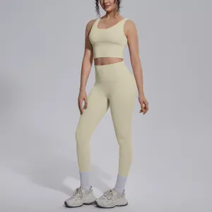 Detail view of beige two-piece yoga set featuring V-neck sports bra and high-waist leggings