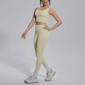 Full body shot of a women's pale yellow yoga set with V-neck top and high-waist leggings.