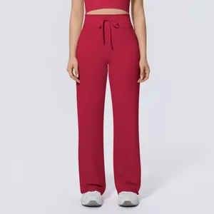 Detailed view of high-waisted red wide-leg yoga pants with adjustable drawstring waist