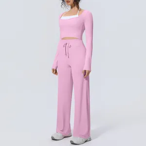 Comfortable pink long-sleeve yoga set with wide-leg pants for Pilates and fitness wear