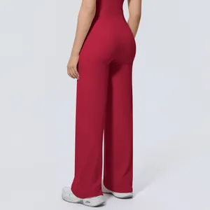 Back view detail of high-waisted red wide-leg yoga pants with loose fit and soft fabric
