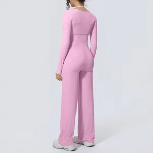 Back view of pink long-sleeved yoga set with wide-leg pants for Pilates and fitness
