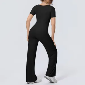 Rear view of black short sleeve yoga crop top and breathable wide-leg sports pants