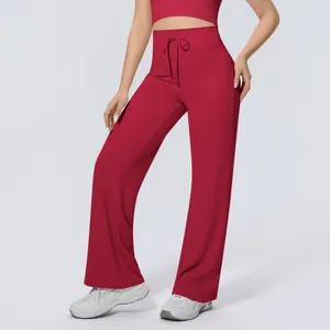 High-waisted wide-leg yoga pants with adjustable drawstring waist in deep red color.