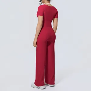 Rear view of a red short-sleeve yoga top and wide-leg sports pants set