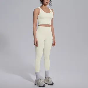 Close-up showing the fit and texture of the cream V-neck yoga set for women.