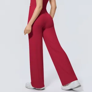 Back view detail of high-waisted red wide-leg yoga pants for fitness and lounge