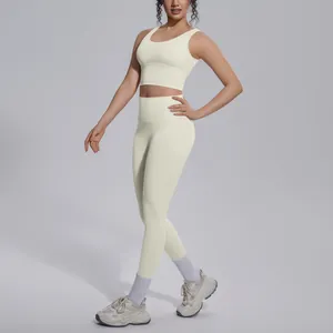 Professional studio shot of a cream yoga set featuring V-neck bra and high waist leggings