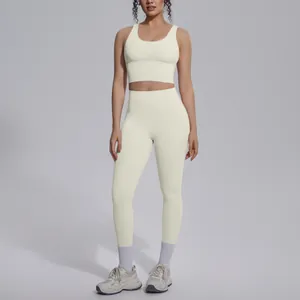 Full view of professional cream yoga set with sports bra and high-waisted leggings