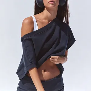 Detail view of navy blue off-shoulder fitness top and high-waisted sports shorts set