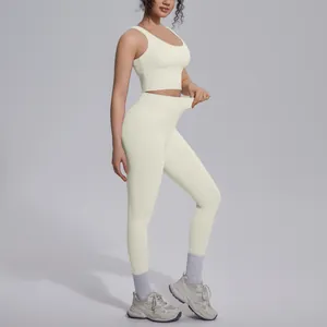 Professional yoga set featuring high-elasticity cream leggings and sports bra combo