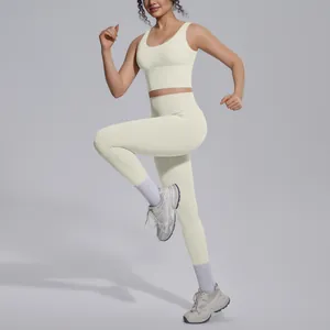 Detailed view of cream seamless V-neck sports bra and high-waist leggings yoga set in motion