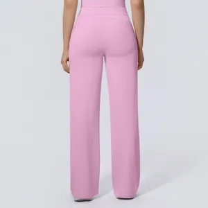 Rear view of pink high-waisted wide-leg yoga pants showing the loose and drapey fit.