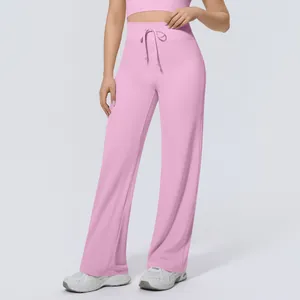 Close-up of pink high-waisted sports wide-leg pants with drawstring detail