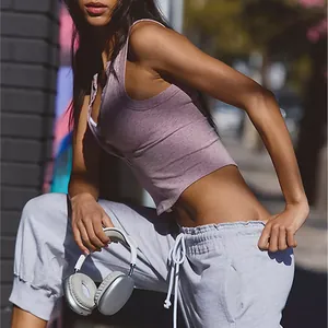 Close-up detail of a mauve ribbed henley sports tank top with stylish button neck