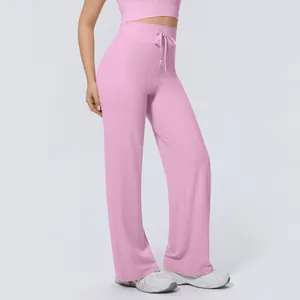 Detail of pink high waisted wide leg yoga pants with drawstring waist for women