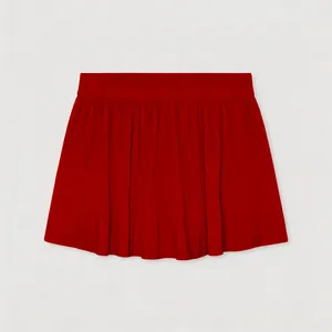 Detail view of vibrant red pleated tennis skirt with quick-dry performance fabric