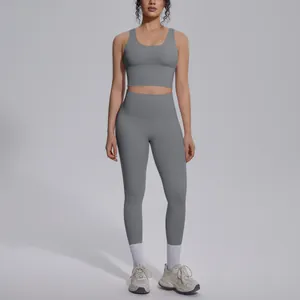 Full body view of grey high-waist yoga set on model featuring V-neck sports bra