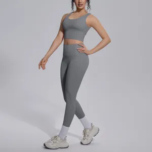 Two-piece gray yoga set featuring a supportive sports bra and high-waisted leggings.